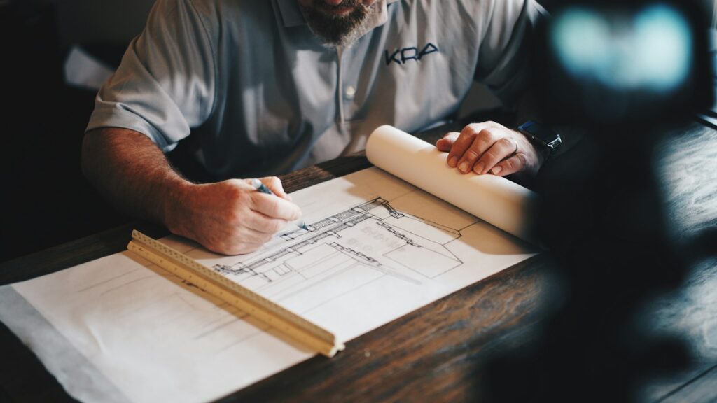 Architect working with building plans, an illustrative photograph for a public planning proposal story