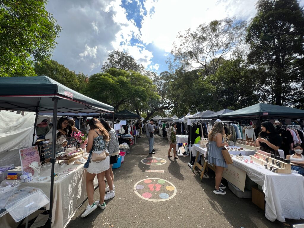 Visitors at an outdoor market, illustrating the atmosphere of a community food festival